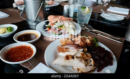 Five Star Lunch Buffet Smorgasbord Food on the Table in Pattaya Thailand all you can eat pile it on food on the plate Stock Photo