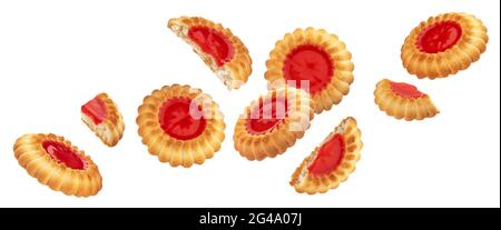 Falling cookies with red berry jam filling isolated on white background Stock Photo
