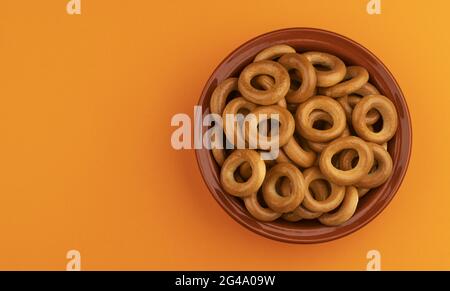 Russian bagels, bread rings on color background with copy space, top view Stock Photo
