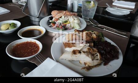 Five Star Lunch Buffet Smorgasbord Food on the Table in Pattaya Thailand all you can eat pile it on food on the plate Stock Photo