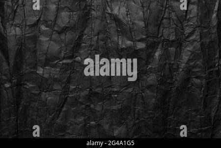 Black crumpled paper texture, grunge background Stock Photo