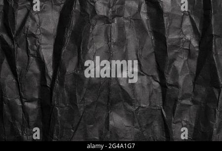 Black crumpled paper texture, grunge background Stock Photo