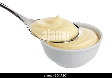 Mayonnaise in spoon isolated on white background Stock Photo