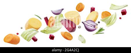 Falling pieces of different vegetables isolated on white background Stock Photo