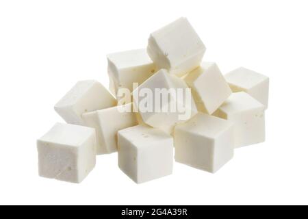 Heap of diced feta cubes isolated on white background Stock Photo