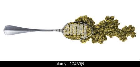 Basil pesto sauce with spoon isolated on white background with. Top view Stock Photo