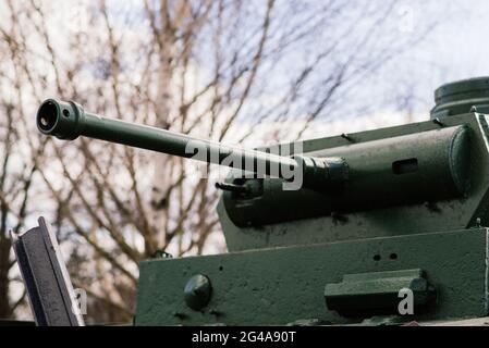 Fragment of a tracked track on a green camouflage tank. Stock Photo