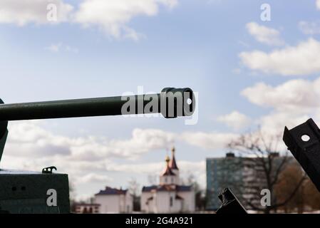 Fragment of a tracked track on a green camouflage tank. Stock Photo