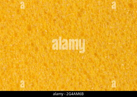 Saturated yellow foam, EVA texture with porosity. Background for perfect design project. Stock Photo