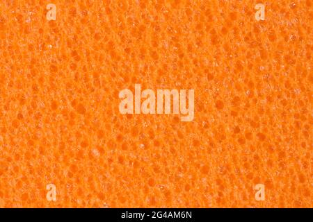 Warm orange foam, EVA texture with contrast porosity. Background for perfect design project. Stock Photo