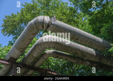 Old and rusty pipeline above the earth. Stock Photo