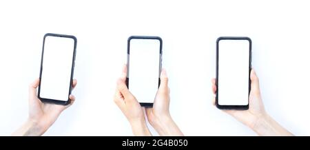 Mockup image ,set of woman's hand holding black smartphone isolated on white background, blank screen for mockup, technology, business, communication Stock Photo