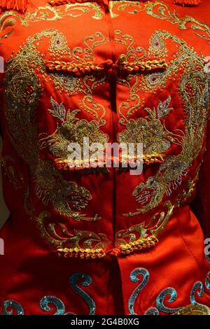 Cloth buttons on a traditional Chinese dress called a Qipao in a costumiers window in Shenyang, China Stock Photo