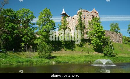 Castle ruins landscape in the Dobele town, Latvia. Old medieval century Latvian cultural monument view on a bright sunny day of the summer season. The Stock Photo