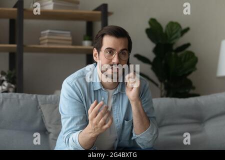 Happy young man holding phone call conversation. Stock Photo