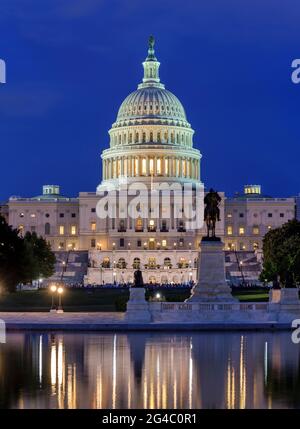 The Capitol - A dusk view of west side of the U.S. Capitol Building, with Ulysses S. Grant Memorial and Reflecting Pool at front, Washington, D.C., US. Stock Photo