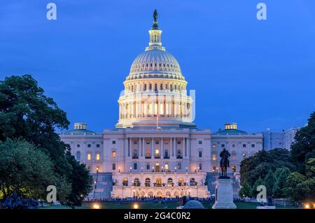 Summer Night at Capitol Hill - A dusk view of west-side of the U.S. Capitol Building, as a summer concert at front, Washington, D.C., USA. Stock Photo