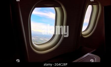 Windows view from Airline Business Class seat, Passenger can enjoy with beautiful view with 2 windows. Stock Photo