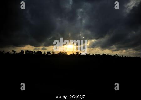 Dark clouds covered the sky at sunset. Stock Photo