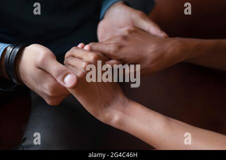 Close up affectionate young african american man comforting woman. Stock Photo