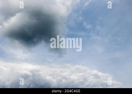 Big clouds in the sky before the summer thunderstorm. Clouds before the rain starts. Stock Photo