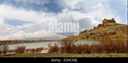 Byzantine monastery known as Yuksek Monastery with the two peaks of Hasandagi Mountain in Guzelyurt, Cappadocia, Turkey Stock Photo