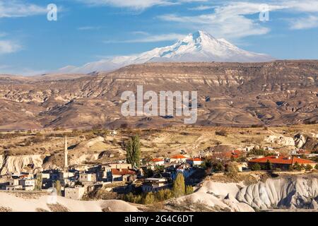 Ibrahim Pasha village with the Volcano Erciyes in the background, Cappadocia, Turkey Stock Photo