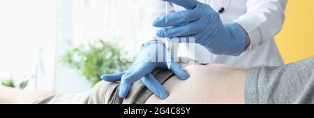 Nurse giving intramuscular injection of medicine into patients buttock Stock Photo