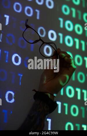 Close-up of computer programmer using eyeglasses during his work on computer Stock Photo