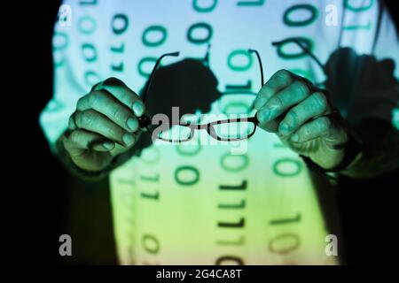 Close-up of computer programmer using eyeglasses from eyesight Stock Photo