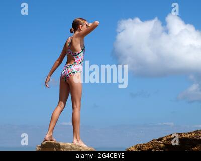 Happy Young Teenage Girl Swimsuit Stands Barefoot Black Background