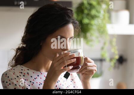 Head shot beautiful woman drinking black tea, enjoying morning Stock Photo