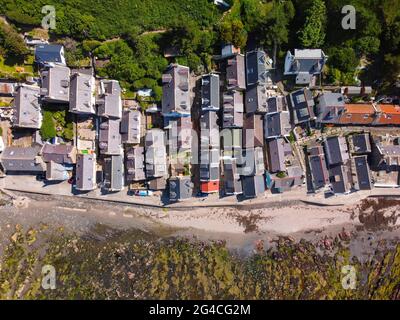 Aerial view from drone of tightly packed cottages in Seatown at historic village of Gardenstown on Moray firth Coast in Aberdeenshire, Scotland, Uk Stock Photo