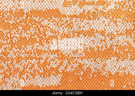 Orange fabric with marbled design. Textile texture background. Abstract backdrop. Stock Photo