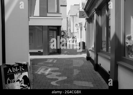 A view of a narrow passageway between shops in The Lanes Brighton, Brighton, East Sussex, England, UK Stock Photo
