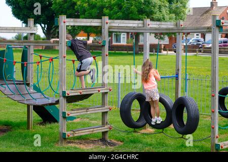 Children playing on a wooden obstacle course in Flamborough,East Yorkshire,UK Stock Photo