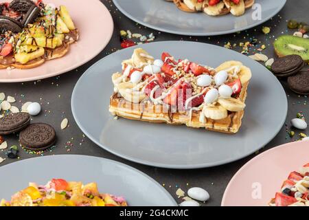 Three different waffles in square, heart and bubble shape. Stock Photo