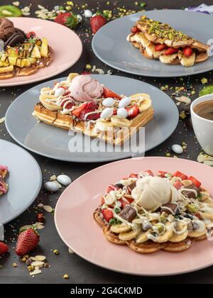 Three different waffles in square, heart and bubble shape. Stock Photo