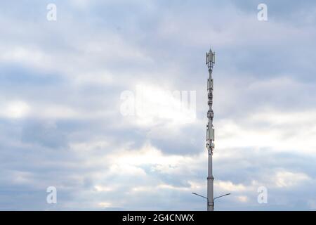 5g station reciever, modern city telecommunication agains the sky Stock Photo