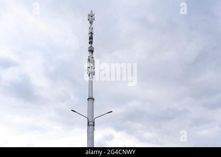 5g station reciever, modern city telecommunication agains the sky Stock Photo