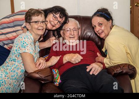 Three sisters with their 97 year old father. Stock Photo