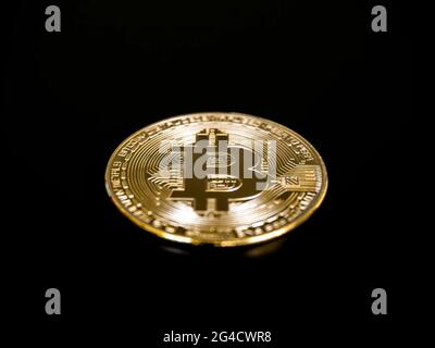 Bitcoin technology on dark background. A golden bitcoin on black background, cryptocurrency investment concept. Digital future coin currency financial Stock Photo