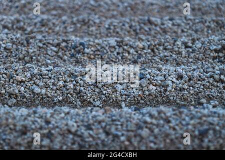 Detail of lines in a zen garden with typical simple raked gravel in Kyoto, Japan Stock Photo