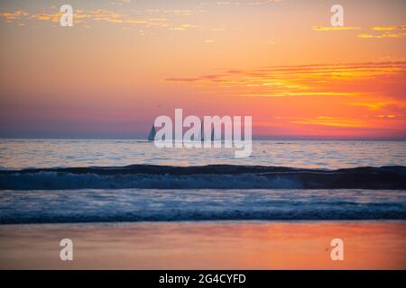 Sunset at the sea. Sunrise on beach. Colorful ocean, nature landscape background with copy space. Stock Photo