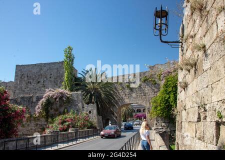 RHODES, Greece – JUN 07, 2021. View of the ancient medieval walls of the Rhodes Town near the Hippocrates Square and Mandraki Harbour. Stock Photo