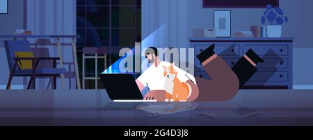 overworked businessman freelancer looking at laptop screen man with dog lying on floor in dark night home room Stock Vector