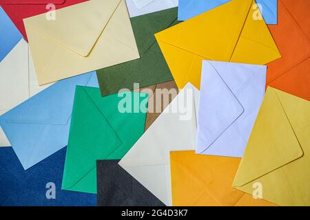 Different colored envelopes on the table Stock Photo