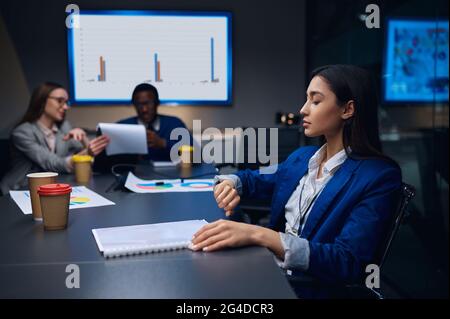 Coworkers on business negotiations in night office Stock Photo