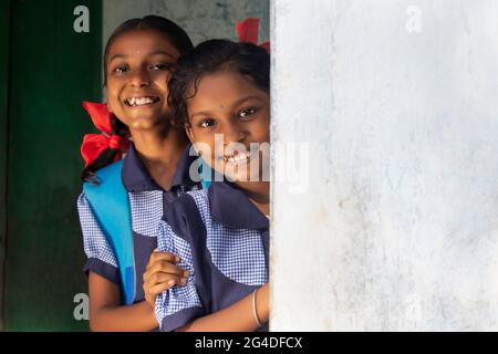 portrait of a rural school girls smiling and standing in school Stock Photo