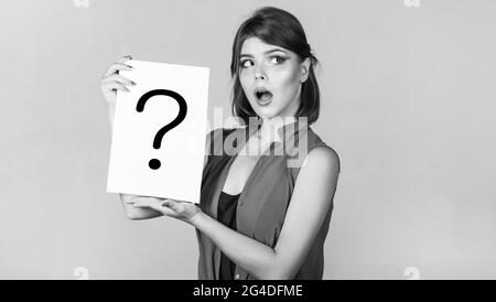 Concept - challenging issue, looking for the answer. Thinking woman. Girl question. Woman with doubtful expression and question marks. Getting answers Stock Photo